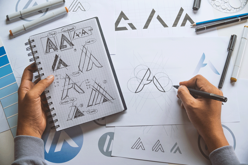 logo-creation-with-graphic-designer-sketches
